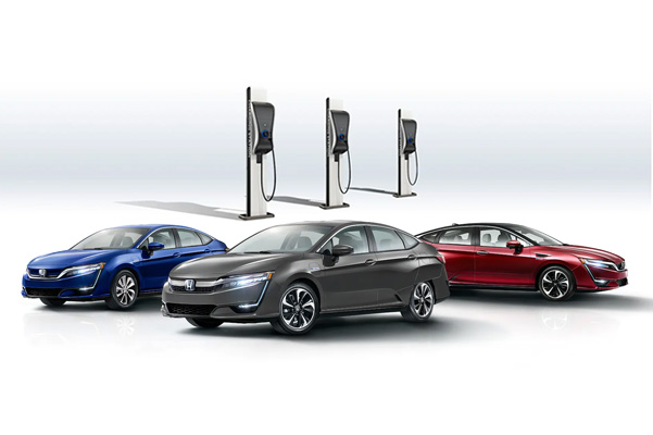 Honda lineup with charging stations behind them