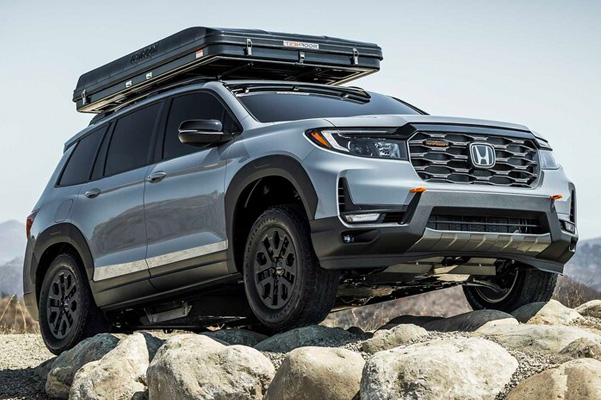 2022 Honda Passport TrailSport parked on top of rocks at top of hill.