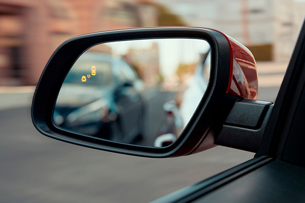 Side mirror of the 2022 Hyundai Venue showing the blind-spot collision warning