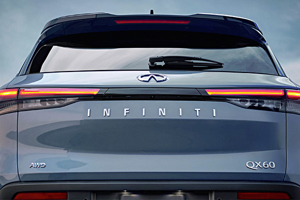 Rear exterior closeup view of the 2022 INFINITI QX60 highlighting LED taillight and QX60 badge