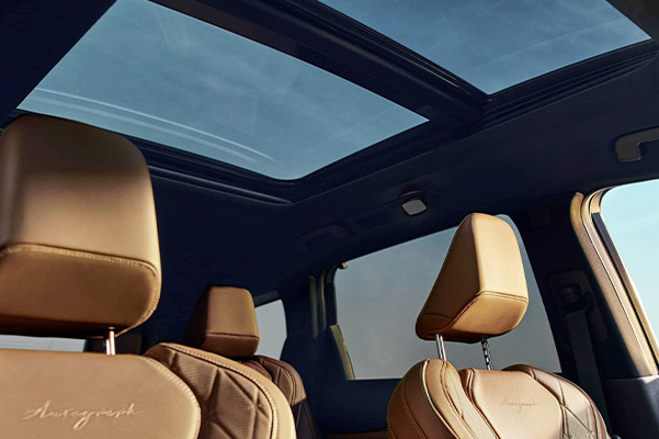 Interior view of 2022 INFINITI QX60 highlighting front seats and moonroof
