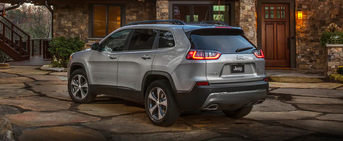 The 2022 Grand Jeep Cherokee parked in a driveway