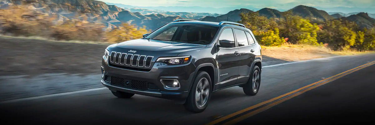 2022 Jeep Cherokee driivng along highway