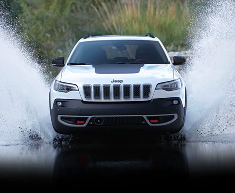 The 2022 Grand Jeep Cherokee driving through water