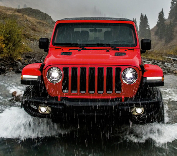 2022 Jeep Wrangler 4xe driving through shallow water