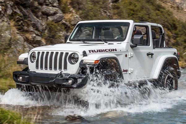 2022 Jeep Wrangler driving through shallow water