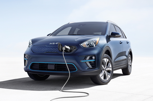 Front of Kia plugged into charging station