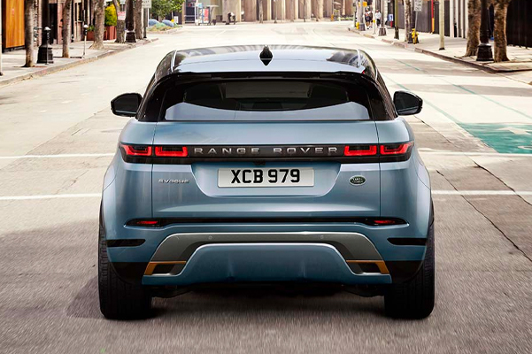 Rear exterior shot of a 2022 Range Rover Evoque on a city street during the day.
