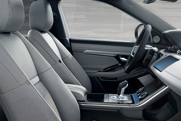 Interior shot of a 2022 Range Rover Evoque Driver's and passenger's seats.
