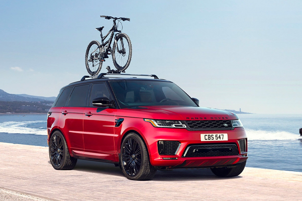 Range Rover Sport with Bike Mounted on Roof Rack.