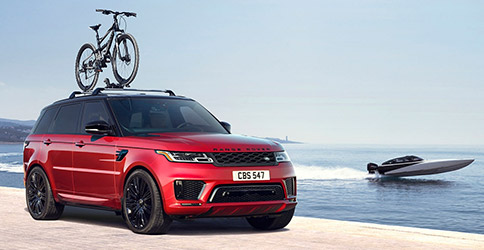 Range Rover Sport with Bike Mounted on Roof Rack.