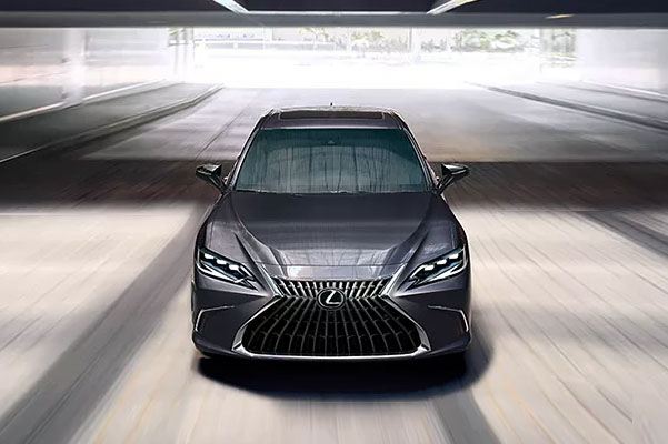Oncoming view of the 2022 Lexus ES driving under an overpass