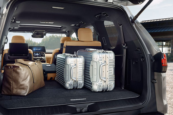 Detail shot of the open trunk of the 2022 Lexus LX 600 with luggage.