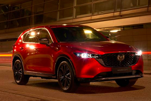 2022 Mazda CX-5 driving through street at night
