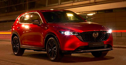 2022 Mazda CX-5 driving through street at night