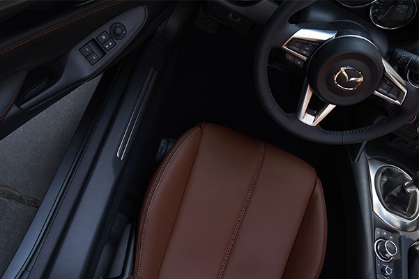 Interior shot of the steering wheel in a 2022 Mazda MX-5 Miata