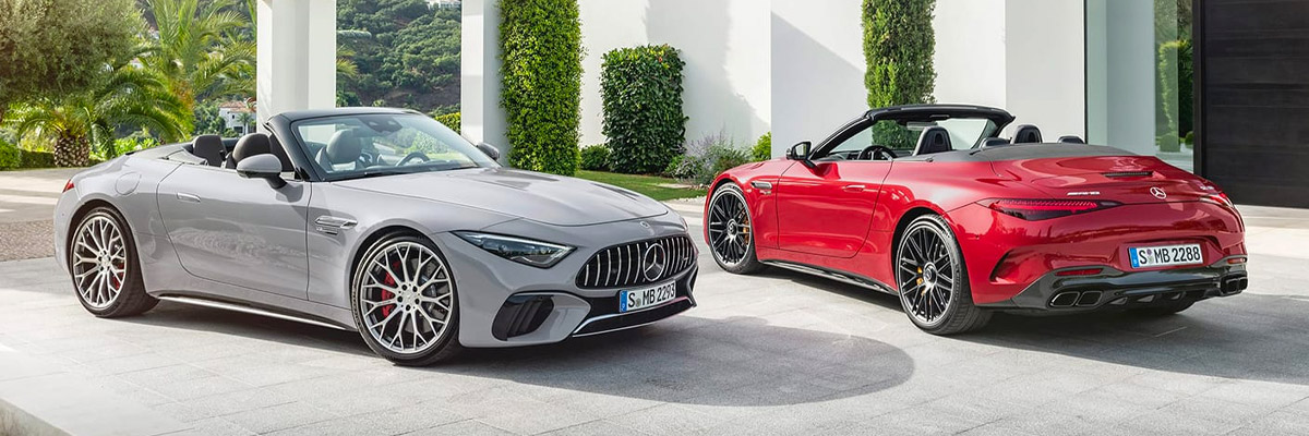 Exterior shot of two 2022 Mercedes-Benz AMG SL parked in a driveway during the daytime.
