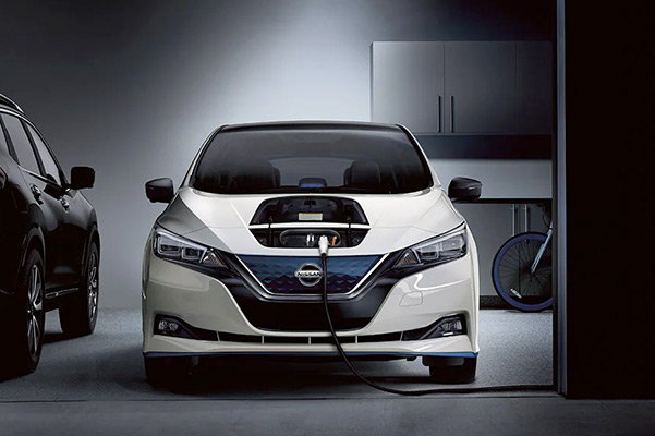 2022 Nissan Leaf charging in garage at nighttime