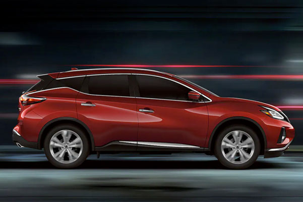 2022 Nissan Murano shown in profile driving down a street at night illustrating performance
