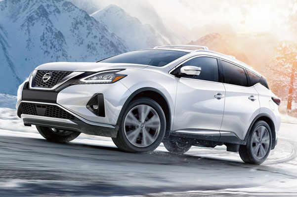 2022 Nissan Murano all-wheel-drive driving up a hill on a snowy road