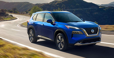 2022 Nissan Rogue driving down a highway