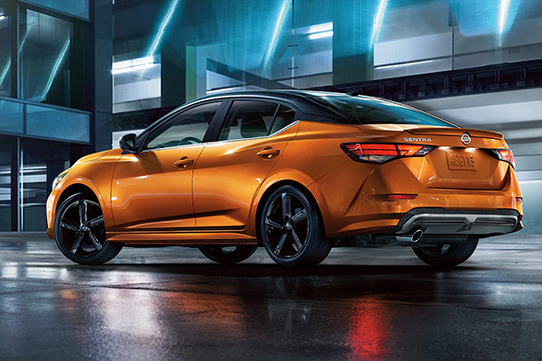 2022 Nissan Sentra in profile at night showing sport-inspired design.