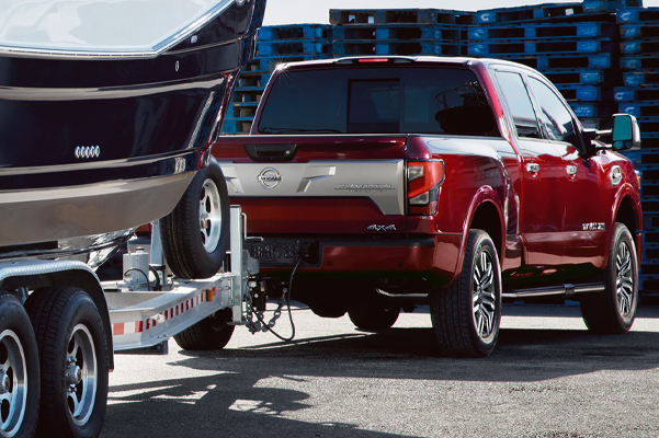 The 2022 Nissan TITAN towing a boat