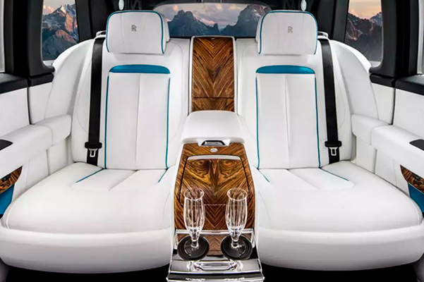 The interior of a Rolls-Royce Cullinan, featuring white leather seating
