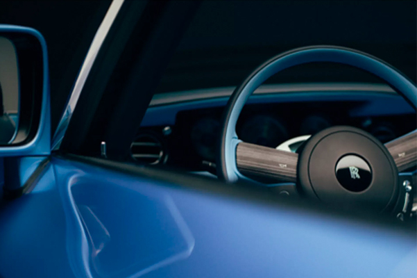 Detail shot of a 2022 Rolls-Royce Ghost steering wheel.