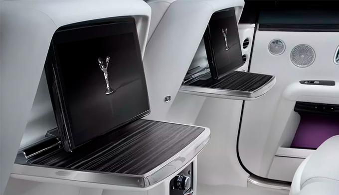 Responsive touchscreens on the front-central control display of Rolls-Royce Ghost motor car.