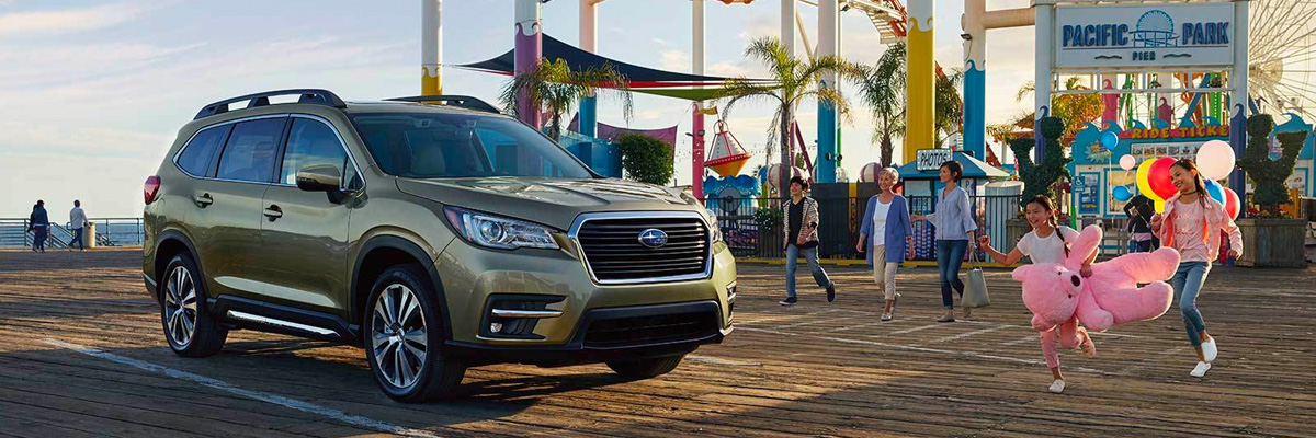2022 Subaru Ascent parked outside fair as family approaches