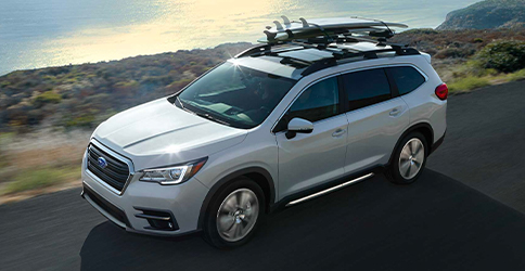 A Subaru Ascent driving on a coastal highway.