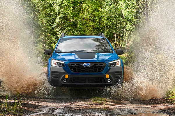 2022 Subaru Outback driving through mud puddle