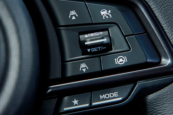 A close-up of the steering wheel controls of the 2022 WRX.