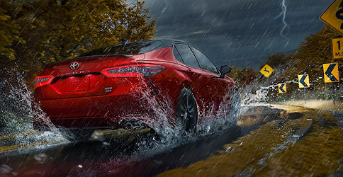 Camry driving in thunderstorm demonstrating all-wheel drive