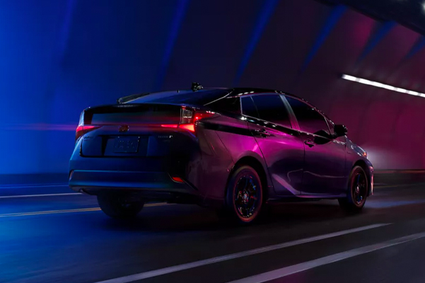 Exterior shot of a 2022 Toyota Prius driving in a tunnel.