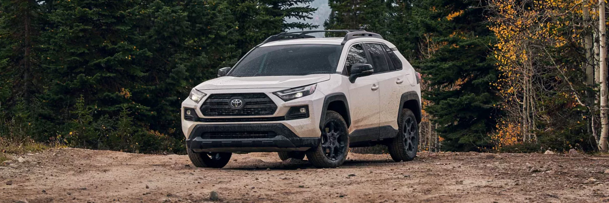 White 2022 Toyota RAV4 parked on dirt road