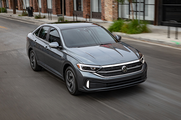 2022 VW Jetta driving down a city street