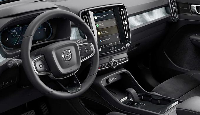 Interior and center console of 2022 Volvo C40 seen from the driver door.
