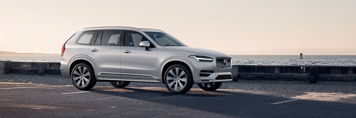 2022 Volvo XC90 Recharge parked next to the ocean