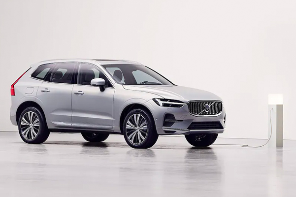 2022 Volvo XC60 Recharge charging in a white studio.