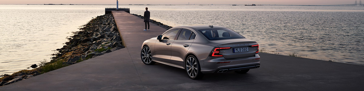 2022 Volvo S60 parked next to the ocean
