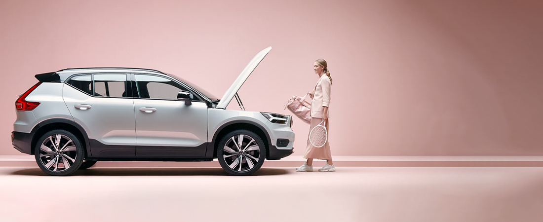 The 2022 Volvo XC40 Recharge with its front hood open, being used as storage
