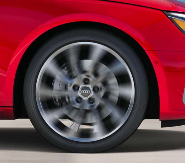 Detail shot of a 2023 Audi A4 wheel spinning.