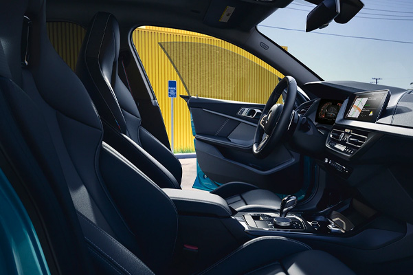 Interior shot of a 2023 BMW 2 Series front seats.