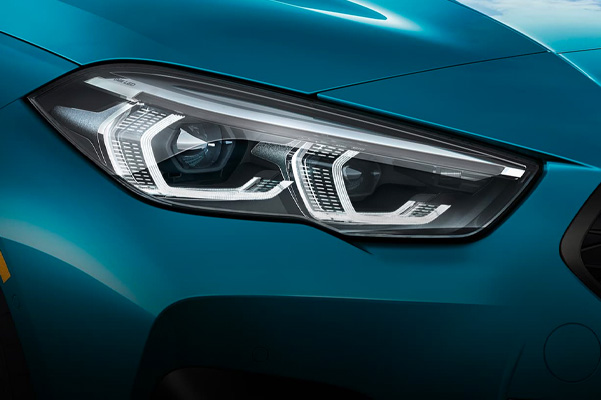 Detail shot of a 2023 BMW 2 Series headlight.