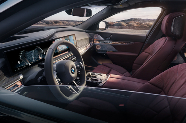 Steering wheel, 12.3 inch screen, and front two seats in the 2023 BMW 7 Series