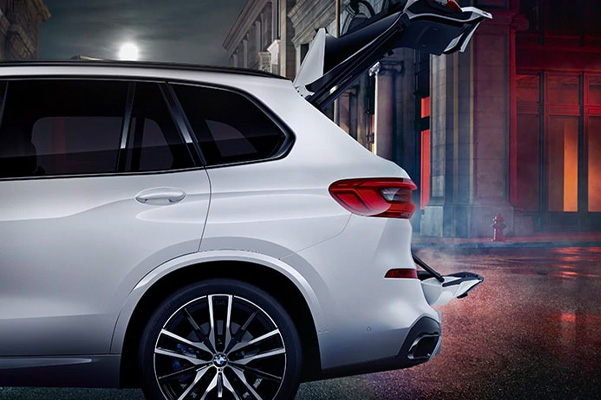 BMW X5 trunk open for easy access to cargo space.