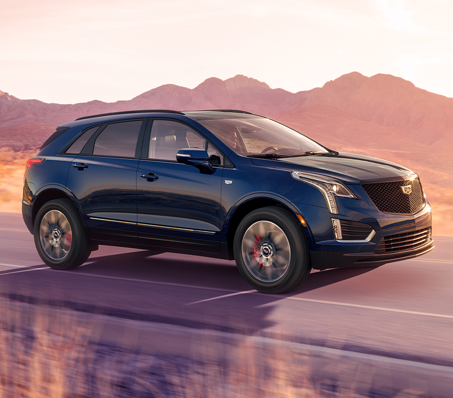 The Crystal White Tricoat Cadillac XT5 Parked in the City