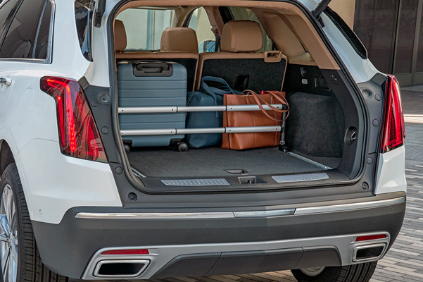 Opened trunk of the 2023 Cadillac XT5 with a suitcase inside